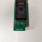 Close-up of an electronic circuit board with a black connector and labeled text.